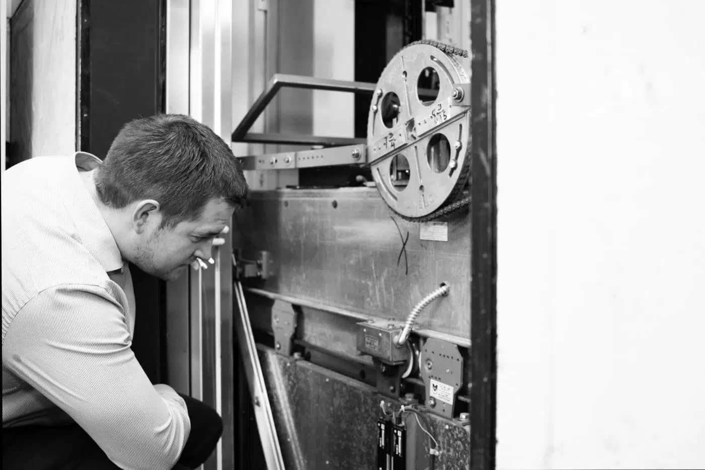 Lift engineer assessing lift condition