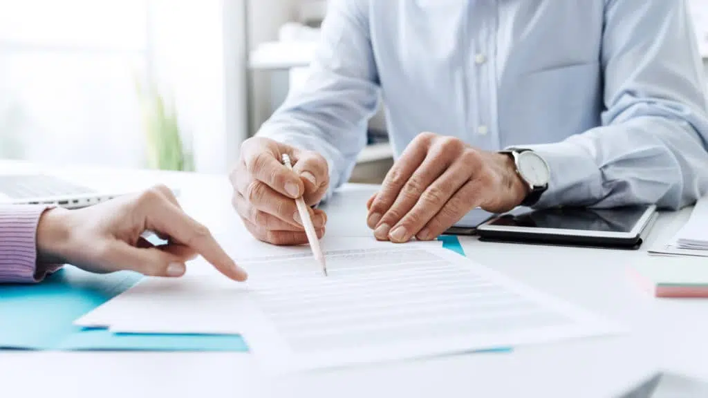 Image of two people's hands suggesting they are discussing