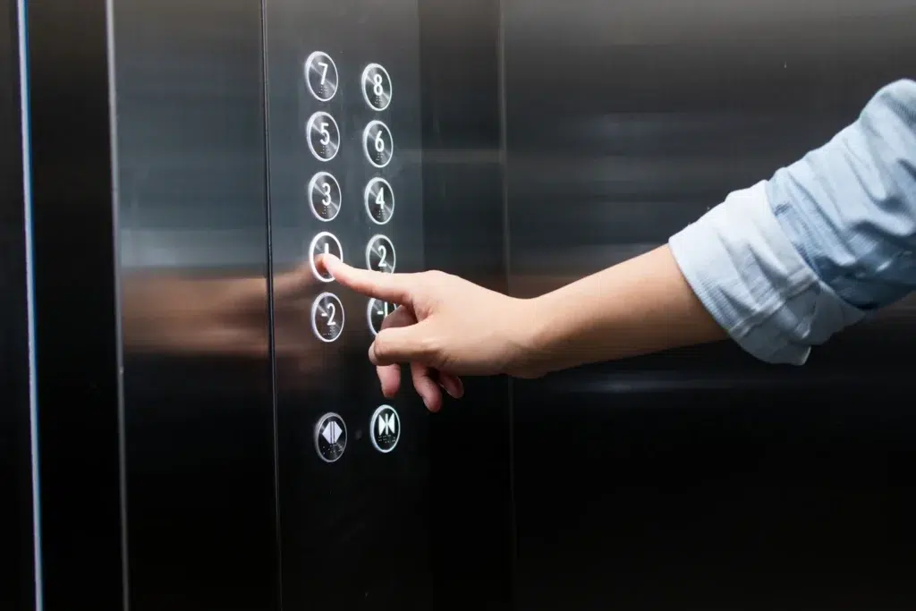 London lift buttons being pressed